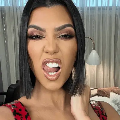 Kourtney Kardashian with a center parted blunt lob