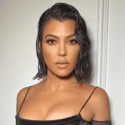 Kourtney Kardashian with side parted wet look lob