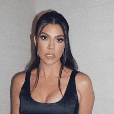 Kourtney Kardashian with Half-Up and sleek hair