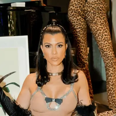 Kourtney Kardashian with half up hair with accessories