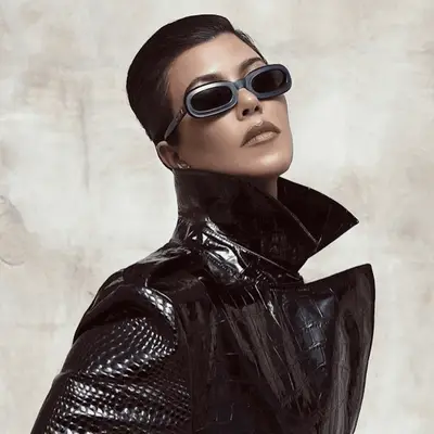 Kourtney Kardashian with a combed back updo