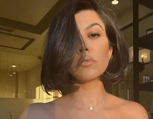 kourtney kardashian looking at camera with bouncy bob