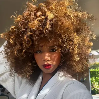 Ginger with hue of brown and blonde in the mix