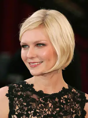Close up of Kirsten Dunst with a blonde chin-length bob