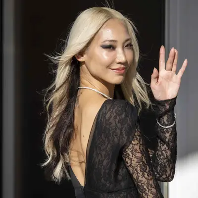 Soo Joo Park with light champagne blonde hair and dark underside