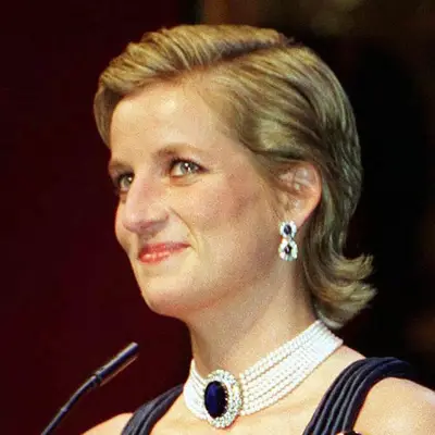 Princess Diana in a sleek hairstyle with a side part and flipped out ends