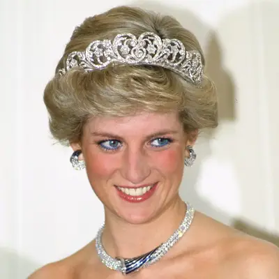 Princess Diana wears the Spencer Tiara with hair curled up around the edges