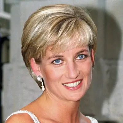 Princess Diana in a side parted mullet cut with layered wispy bangs
