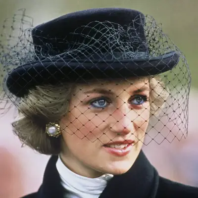 Princess Diana wore a black hat with netting designed by Viv Knowland and a remembrance poppy attending a service commemorating the 70th anniversary of the armistice