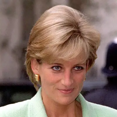 Princess Diana wears a grown out pixie cut blowdried for height and smooth-straight texture