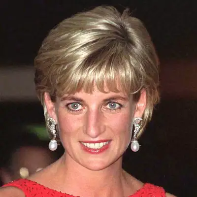 Princess Diana tucks her bob behind her ears to showcase her jewelery
