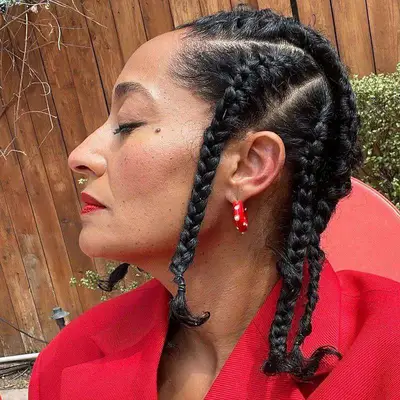 Tracee Ellis Ross wears shoulder-length box braids with triangle parting