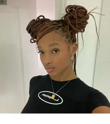 Woman with braided space buns