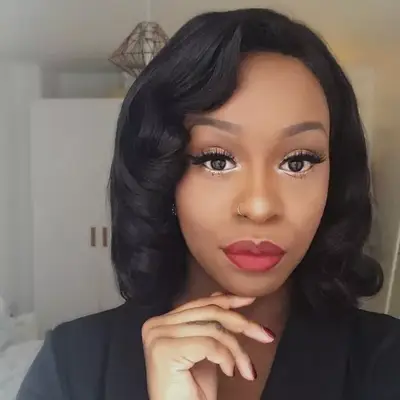 wearing a wig: Giselle La Pompe-Moore wearing a short wig