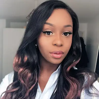 wearing a wig: Giselle La Pompe-Moore wearing a long red wig