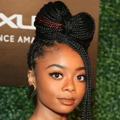 Skai Jackson wearing bow-shaped box braid bun