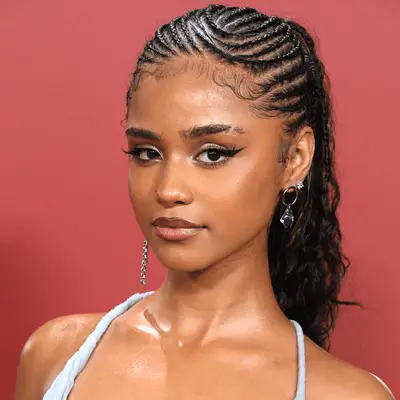 Tyla wearing cornrows with curly ponytail 