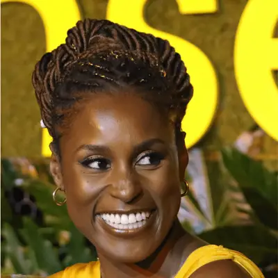 Issa Rae wearing cornrows and faux locs hairstyle