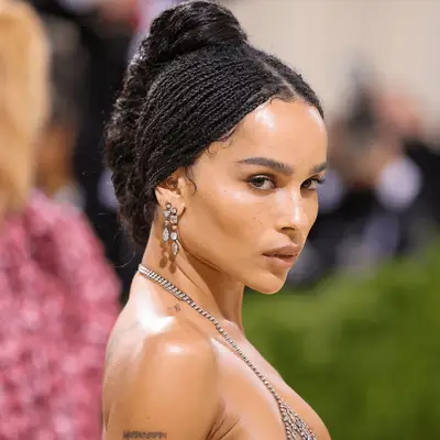 Zoe Kravitz wearing a french twist and microbraids