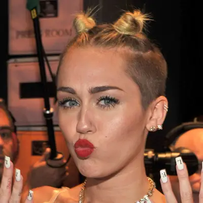 Miley Cyrus with undercut and space buns at 2013 MTV Video Music Awards