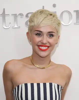 Miley Cyrus wearing a platinum pixie cut in 2013