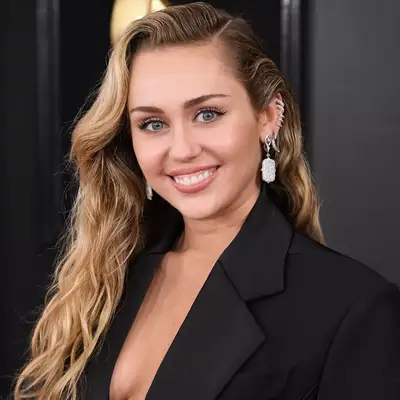Miley Cyrus with cascading beach waves 