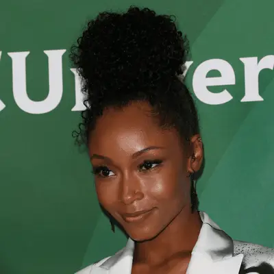 Yaya Dacosta with high curly topknot