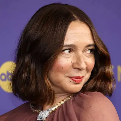 Maya Rudolph looking to the side, posing at a formal event