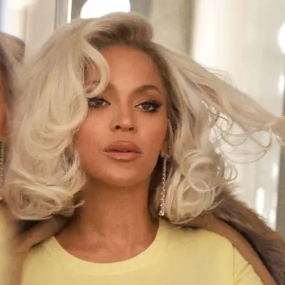 Beyonce wears a platinum bob in big bouncy Hollywood curls