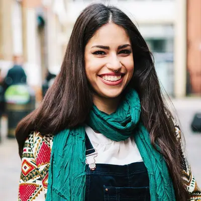 woman with long hair smiling