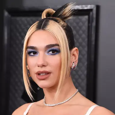 Dua Lipa with blonde and black hair at the 2020 Grammy Awards in Los Angeles