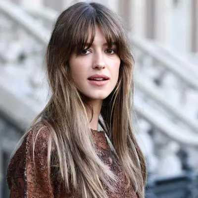 Daisy Edgar-Jones wears ashy highlights at the ends of her brown hair color