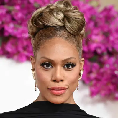 Laverne Cox wears an ashy brown updo