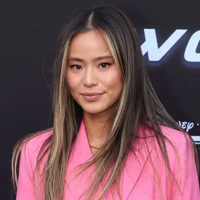 Jamie Chung wears face framing ashy highlights in her dark brown hair