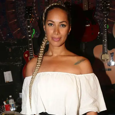 Leona Lewis wears an overdirected ash blonde braid against her brunette base