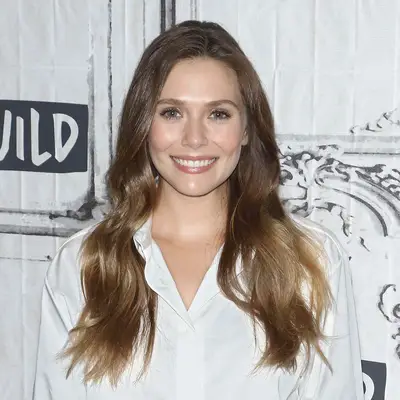 Elizabeth Olsen wears ash brown hair color with lighter ends