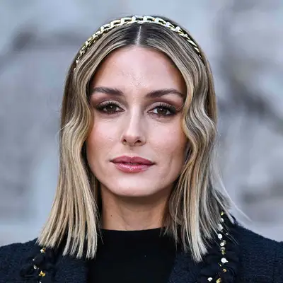 Olivia Palermo wears icy white highlights for an ash brown color