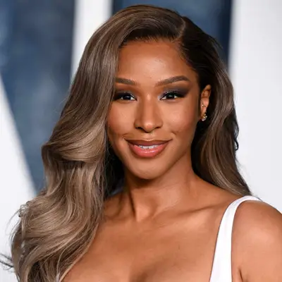 Savannah James wears ashy highlights in her dark brown hair