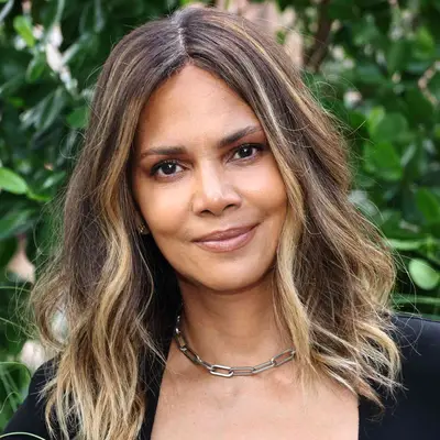Halle Berry wears ashy blonde highlights on her natural brown ends to a Michael Kors show