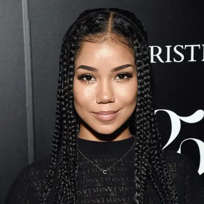 Jhene Aiko wears large box braids and neutral makeup
