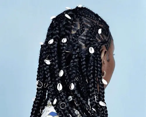 closeup box braids with puka shells