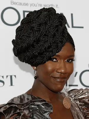 Bozoma Saint John in box braids sculpted into large side crown 