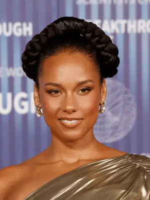 Alicia Keys in two jumbo braids pulled up for an arch crown