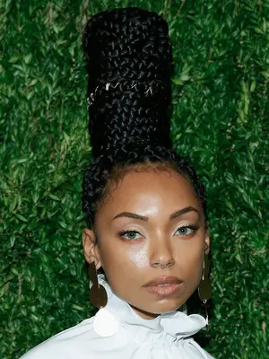 Logan Browning in tall braided updo