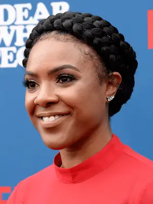 Courtney Sauls in two jumbo braids wrapped into a halo