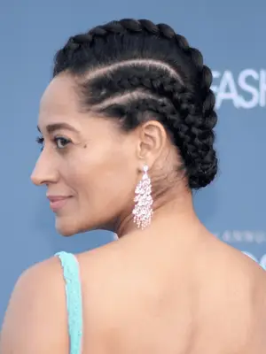 Tracee Ellis Ross in large straight back cornrows tucked at the ends 