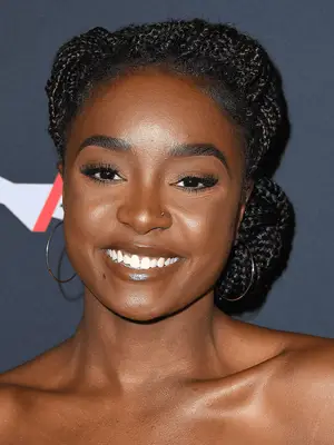Kiki Layne in box braids with chignon and front twist