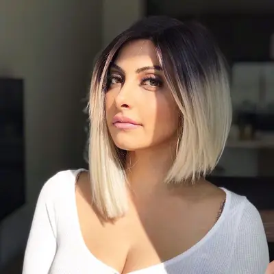 Person wears dramatic asymmetrical bob