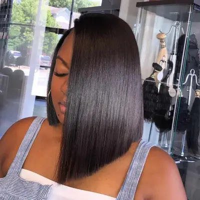 Person with sleek asymmetrical bob