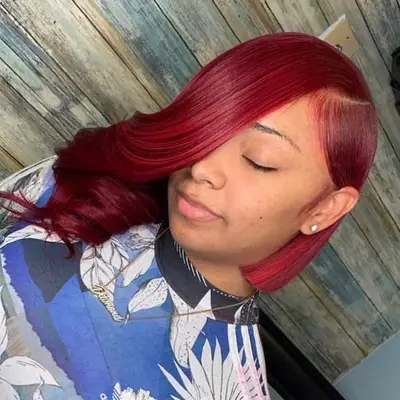 Person wears red asymmetrical bob